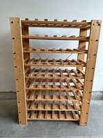 Front view of the complete wooden wine rack with 8 shelves designed for horizontal bottle storage.