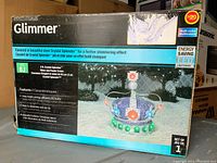 Photo of the boxed Crown decoration showing brand, product image, model name, and features