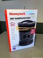 Front view of Honeywell 360 degree surround heat heater box showing model image and features.