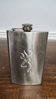 Front view of the Browning stainless steel flask showing the embossed logo and screw cap.