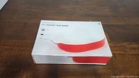 Box of 10 inch ceramic oval baker showing packaging and product image with red oval baker.