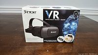 Box showing INRKT VR Virtual Reality Headset and Remote control front image.