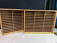 Two wooden VHS storage boxes side by side showing front open slot design and size.