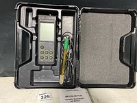 Photo of Hanna Instruments HI 9124 pH meter in its carrying case including the attached electrode and space for other accessories.