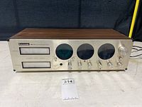 Full view of the vintage Panasonic stereo and 8-track player showing front panel with cartridges slots and control knobs.