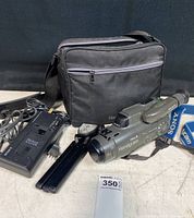 Full view of Sony Video 8 Handycam, carrying bag, battery chargers, batteries, and tripod stand