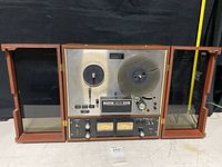 Front view of TEAC 4010 GSL in walnut case with glass doors open