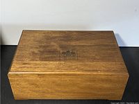 Photo showing full top view of wooden box with Antinori logo.