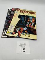 Four Deadshot comics stacked showing the cover of 'Deadshot Search' Issue #1 in front with three other Deadshot comics behind.