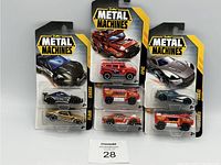 Lot of 7 Zuru Metal Machines vehicle packs in original packaging. Each pack contains two vehicles, including sports cars and fire trucks with detailed paint and design.