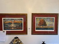 Two framed Janet Searfoss art prints, "Once in a Blue Moon" and "Glory Tree", hanging side-by-side on a white wall.