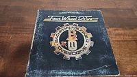 Front cover of Bachman Turner Overdrive Four Wheel Drive vinyl LP with signs of wear and scratches.