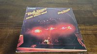 Front cover of the Bob Seger & The Silver Bullet Band "Nine Tonight" double vinyl LP album with stage lights and drum set visible.