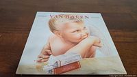 Front cover of Van Halen 1984 vinyl album showing cherub with cigarette pack.