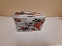 Boxed Betty Oliver pasta machine with images and product text.