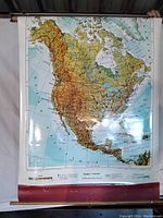 Full view of the roll-up map showing most of North America including Canada, the United States, Mexico, and surrounding waters.