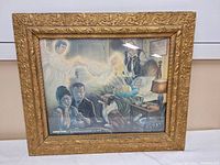 Front view of vintage framed print showing the full image including figures and frame detail