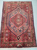 Full view of rug laid flat, showing overall design and color palette