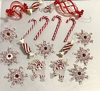 All ornaments laid out on flat white surface showing all pieces in lot.