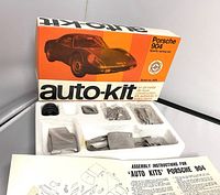 Box and internal foam packaging showing metal parts, tires, and instruction sheet
