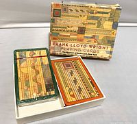 Top view of the two decks of Frank Lloyd Wright playing cards from MoMA with artwork box and card backs showing.
