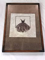 Full view of the signed artwork mounted on a heavy metal plaque showing the entire presentation and framing