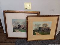 Two framed signed William Nutting tinted photos of scenic countryside with trees and path.