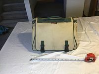 Closed beige Kuny auto tool bag with green trim and handle with measuring tape showing width approximately 16 inches.