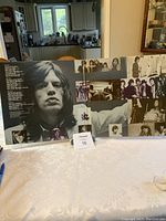 Gatefold opened showing black and white photographs of band members and printed song lyrics for Hot Rocks 1964-1971 album.