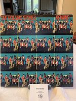 Front cover of The Rolling Stones Rewind 1971-1984 vinyl album showing band members in colorful outfits, includes album title and band name text.