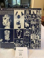Back cover of 'Emotional Rescue' vinyl album showing artistic black and white abstract faces and figures in a collage pattern.
