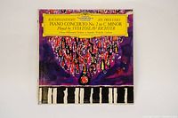 Front cover of the LP album, showing colorful design with purple and red tones, piano keyboard image and yellow title label.