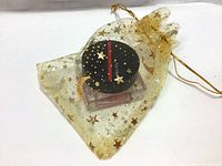 Blush in gift bag with gold star and moon mesh pouch