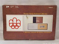 Original box showing Canada Post logo and Olympic rings graphic with visible wear and marks.