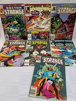 Set of 7 vintage Marvel comic books featuring Doctor Strange and Cloak & Dagger, showing front covers, vibrant artwork, and Marvel Comics Group branding