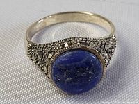 Close-up image showing the ring's lapis lazuli center stone and marcasite accents on sterling silver band.