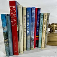 Front view of 10 art and photography books with visible titles showing variety of art topics and publishers.