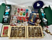 Full lot overview showing assortment of vintage Christmas ornaments, lights, candle holder, holiday tray and nativity figures.