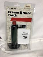 New Fox Run creme brulee torch in clear retail packaging showing front view and branding.