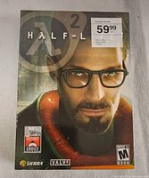 Front cover of Half-Life 2 PC game case displaying character Gordon Freeman and game ratings.