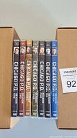 Photo showing the seven DVD box sets for Chicago P.D. Seasons 1 to 7 in a row with visible season numbers and character artwork on the spines.