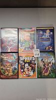 Photo showing six Disney DVDs: Beauty and the Beast, Recess: School's Out, Cinderella, Lion King 2: Simba's Pride, Mickey Sports Fun, and Tangled.