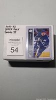 Sealed stack of 2021/22 Upper Deck Series 2 hockey cards (200 cards) with a visible card of Auston Matthews on top