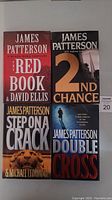 Photo of four hardcover James Patterson books: The Red Book, 2nd Chance, Step on a Crack, Double Cross
