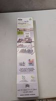 New in box multi-use and stackable shoe rack with clear image of packaging and product details.
