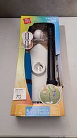 Front view of T-Ball set in original packaging showing the bat, ball, tee and base.