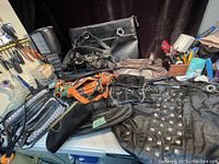 Overview of the lot showing multiple purses and the laptop briefcase, highlighting the variety of colors and styles.