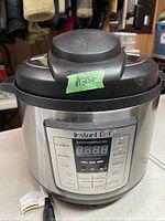 Front view of Instant Pot showing control panel and stainless steel body.