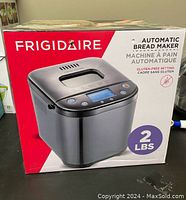 Frigidaire branded retail box showing image of bread maker, 2 lbs capacity, gluten-free setting indicated.