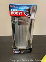 Front view of boxed Heat & Clean Car Boost device showing branding and general packaging condition.